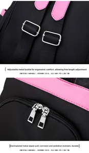 Detail of adjustable metal buckle and dual silver zippers on a black and pink backpack