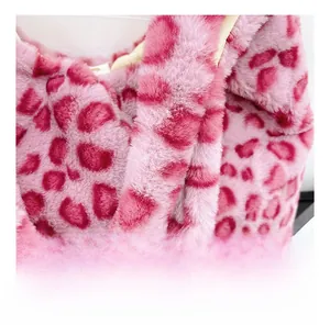 Close-up of pink leopard faux fur plush bag showing the soft texture and wide shoulder strap