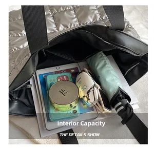 Macro shot showing the spacious interior of the silver quilted tote bag with various items