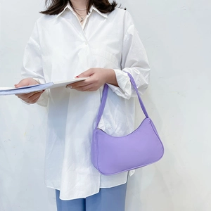 Minimalist purple nylon hobo bag for women featuring a clean zip closure and sleek design