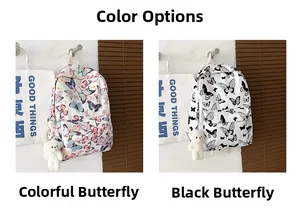 Detail view of white canvas backpacks featuring colorful and black butterfly patterns