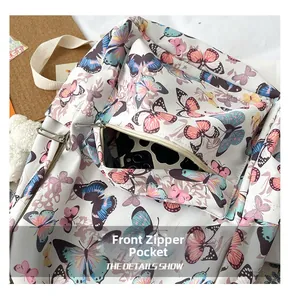 Detail view of the butterfly pattern school backpack featuring a zipper front pocket