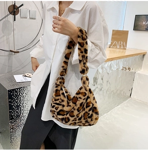 Close-up of fluffy leopard print plush shoulder bag with high-quality faux fur texture