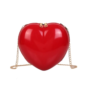 Red heart-shaped mini crossbody bag in glossy patent leather with gold chain strap