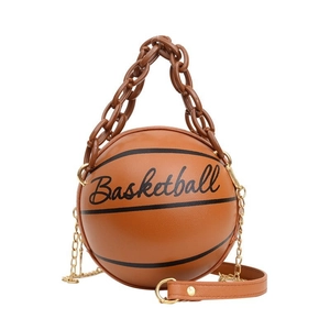 Detail of basketball shaped handbag with brown pebble texture and resin chain strap