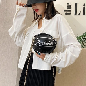 Unique black and white basketball shaped crossbody bag with stylish gold chain strap