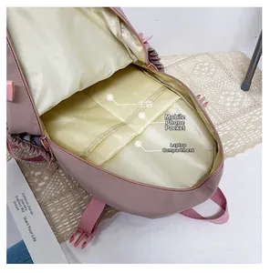 Pink school backpack interior with main compartment, phone pocket and laptop sleeve