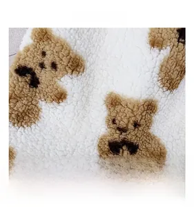 Close-up of the plush faux fur material with teddy bear pattern on the tote bag
