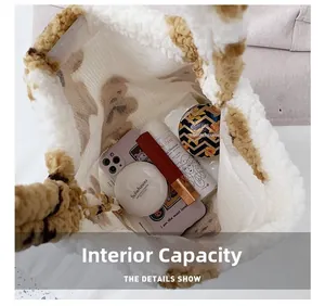Spacious interior of plush tote bag showing storage for phone and cosmetics