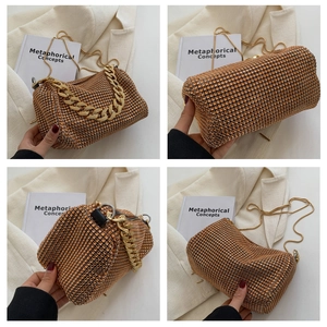 Macro detail of the champagne gold rhinestone evening bag with elegant chain straps