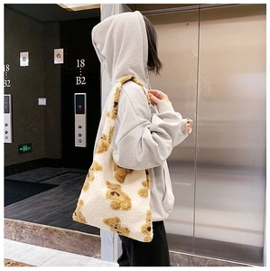 Detail showing plush teddy bear pattern and soft lamb wool texture on large tote bag