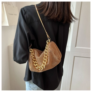 Detailed back view of a champagne gold rhinestone shoulder bag with metal chain strap