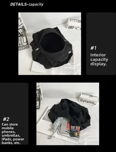 Detail view of the black canvas tote bag internal large capacity and storage compartments