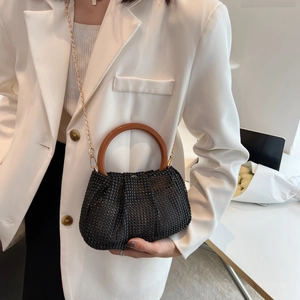 Sparkly black rhinestone woven handbag with round wooden handle and gold chain strap