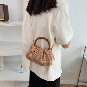 Sparkling champagne rhinestone woven handbag with round wooden handle and gold chain strap