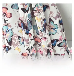 Detail of wide comfortable shoulder straps on butterfly print school backpack for students