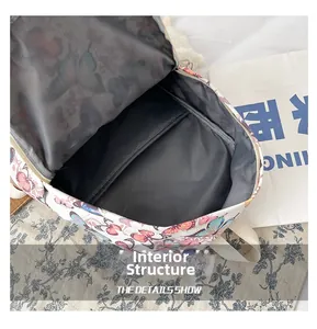 Detail view of the spacious internal structure and grey lining of the butterfly backpack