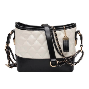 Classic quilted shoulder bag in black and white leather with metal chain strap