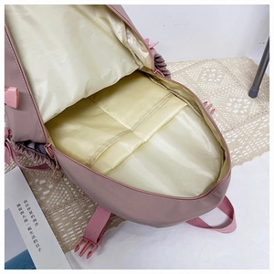 Detail view of the spacious inner compartments of this pink Japanese style backpack