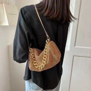 Golden rhinestone shoulder bag with chunky chain strap and sparkling mesh finish for women