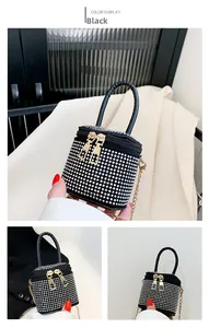 Detail of a mini bucket bag featuring black suede with sparkling silver rhinestones