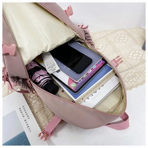 Top view of pink large-capacity backpack showing internal storage for tablets and books