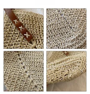 Detailed close-up of straw woven texture and brown leather strap with cross-stitch details