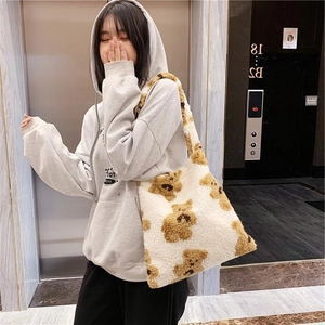 Plush faux shearling tote bag with cute cartoon bear pattern for winter fashion