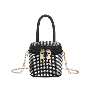 Sparkly rhinestone mini cylinder bag with silver crystals, top handle and gold chain strap