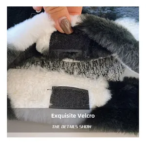 Detailed close-up showing the secure velcro fastener on the plush black and white tote bag