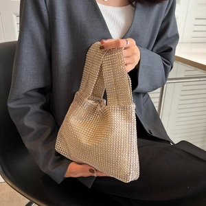 Champagne gold rhinestone clutch handbag with sparkling mesh texture for elegant evening wear