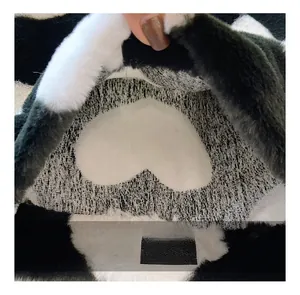 Macro shot of black and white heart pattern on soft plush tote bag fabric details