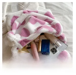 Top view of a plush pink and white checkered tote bag showing spacious inner storage