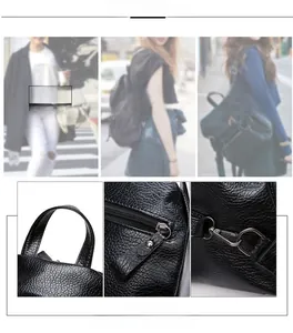 Detail of black litchi grain leather backpack with top handle and metal buckle adjustment