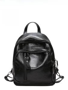 Front detail of black washed leather backpack featuring multi-zipper pockets and lychee texture