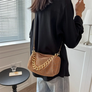 Elegant gold rhinestone mesh handbag with bold chain handle for luxury evening styling