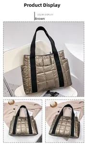 Detail view of the brown quilted tote bag with shiny nylon finish and side pocket