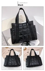 Detail of black quilted puffer tote bag with ribbon handles and side pockets for women