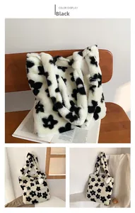 Detailed plush tote bag with black flower pattern and white heart-shaped fluffy charm