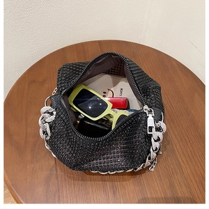 Top view of black rhinestone hobo bag showing spacious interior with silver chain