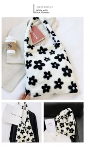 Detail of plush faux fur tote bag featuring a white and black sun flower pattern