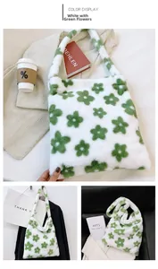 Close-up of white faux fur tote bag featuring green flower patterns and plush texture
