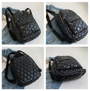 Detailed views of the black quilted puffer backpack showing seams, zippers and straps