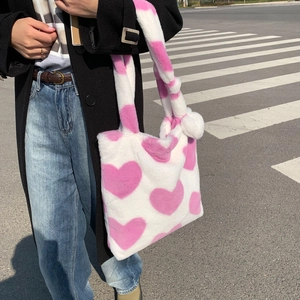 Faux fur tote bag with pink heart pattern and plush ball pendant for women