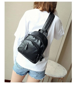Fashionable black pebbled leather backpack for women with adjustable straps and multi-zippers