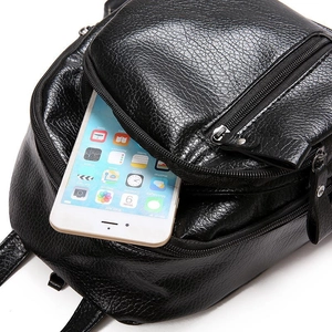 Fashionable black pebble leather backpack featuring a spacious front zipper pocket and soft texture