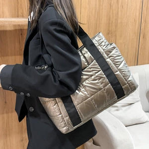 Large capacity champagne quilted tote bag with black webbing straps for casual daily use