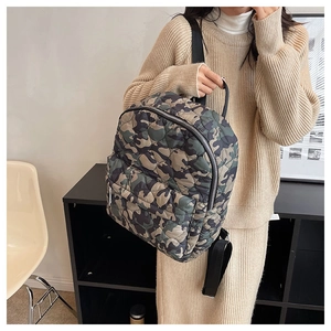 Side view of a camo quilted nylon backpack on a model with spacious zipped compartments