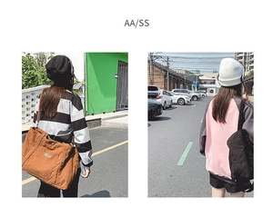 Detail view of large capacity canvas and corduroy shoulder bags for casual daily use