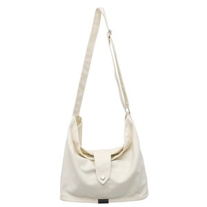 Minimalist beige canvas crossbody bag with adjustable strap and silver snap button